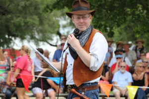 Gery MC's the Indiana Jones bullwhip fast draw competition at the Annie Oakley Festival in 2019